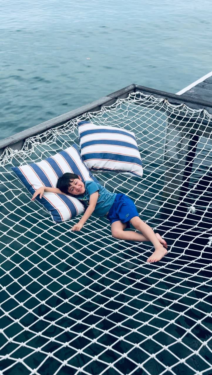 Boy lounging on the beach